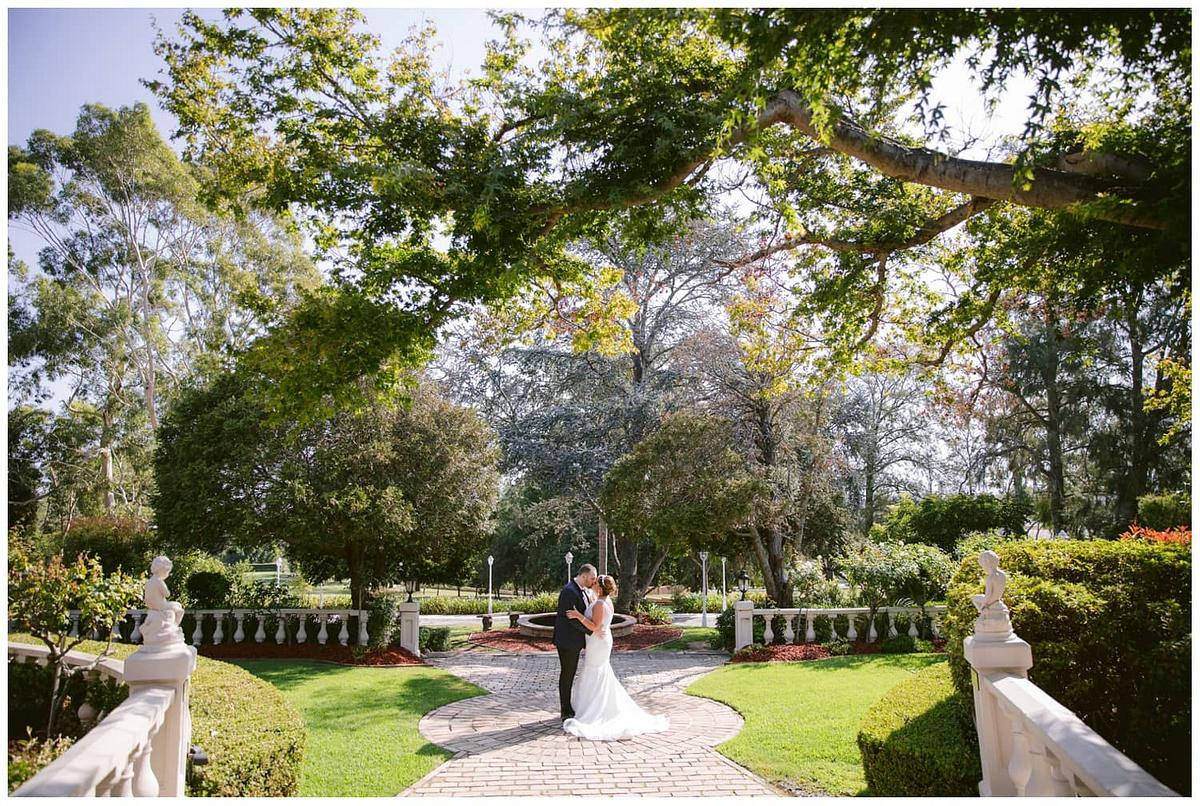 Elegant bridal portrait of the newlyweds in a scenic outdoor setting at Oatlands House.